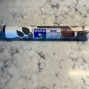 Chesapeake Wallpaper Border. Basket with flowers and bird nest design.